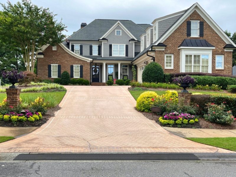 Vehicle ramp kit for steep driveways, providing a smooth transition from street to driveway and preventing car scraping.