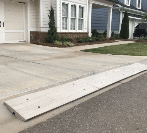 Long driveway curb ramp solution to prevent scraping on steep concrete entry