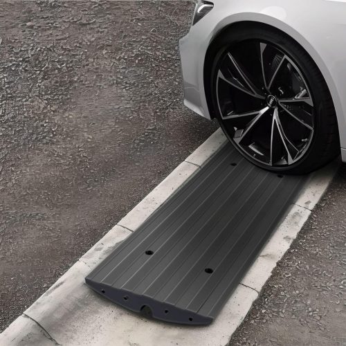 Black driveway ramp for low-profile car clearance over a steep curb with a smooth transition design.