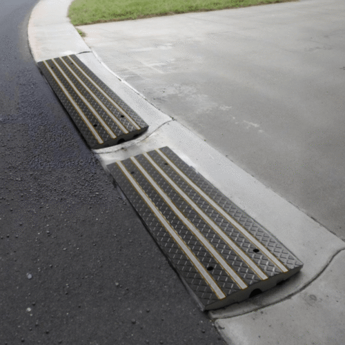 Installed rolled curb driveway ramps for low car clearance and smooth entry