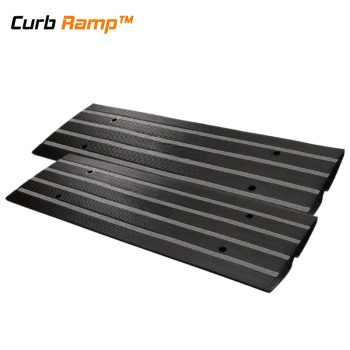 Steep driveway ramp for lowered cars with a smooth slope and integrated drainage, reducing vehicle impact and preventing scraping on rolled curb driveways.