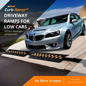 Driveway ramps for low cars preventing scrapes on steep driveway approaches with a blue sports car