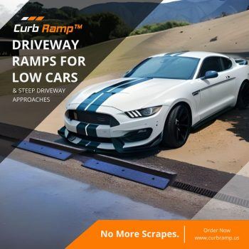 White sports car with racing stripes using low-profile driveway ramps on a steep incline