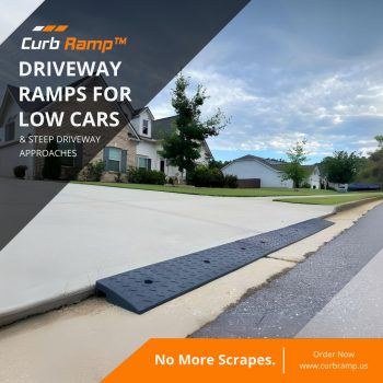 Low-clearance vehicle ramp installed on a residential driveway to prevent scraping on a steep curb