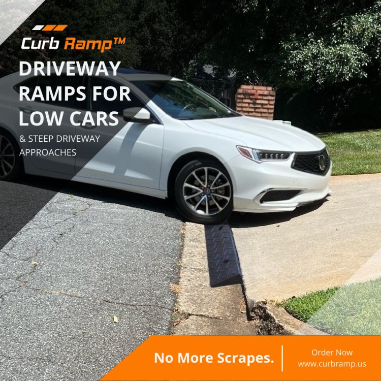 A white low-clearance car using a driveway ramp to smoothly navigate a steep driveway curb without scraping.