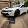 Two-Ramp Driveway Lip Clearance System for Low Sports Cars BMW i8 using a driveway-side and street-side ramp setup to cross a steep gutter lip without scraping the front bumper.