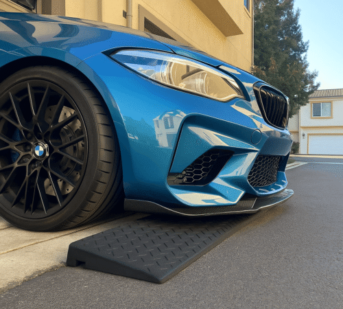 Garage Entry Ramp for Low Clearance Vehicles – Avoid Scraping at Threshold Blue BMW using rubber threshold ramp to prevent scraping at garage entry