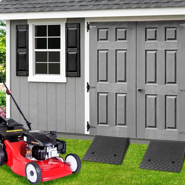 Heavy duty rubber ramps installed at the entrance of a shed for easy access with lawn equipment