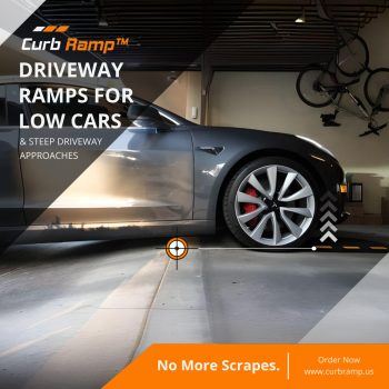 Gray car in a garage using driveway ramps to prevent scraping on steep entrances