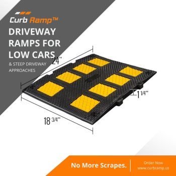 Square driveway ramp with yellow blocks designed to protect low vehicles from scraping