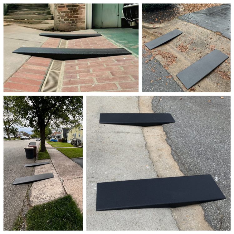 Images showing black driveway aids in position to assist vehicles in smoothly navigating steep driveways and curbs without damage.