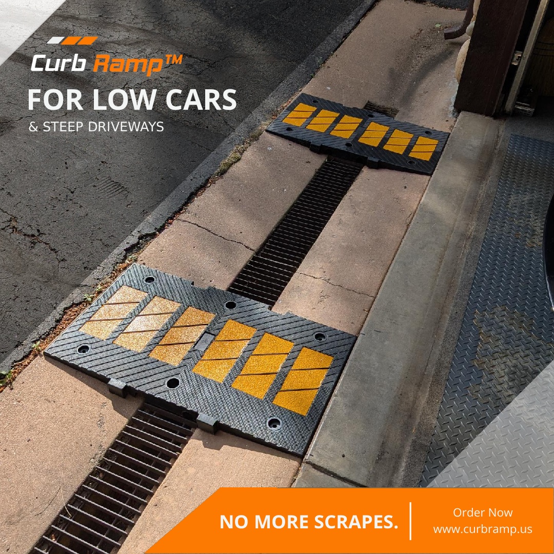 Curb Ramp™ driveway curb ramps bridging a street gutter and drain to prevent scraping for low cars.
