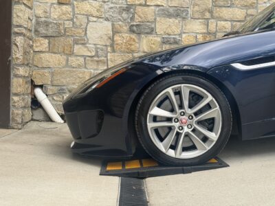 jaguar-using-curb-ramp-to-clear-trench-drain-on-sloped-driveway