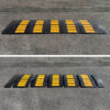 Two modular rubber driveway ramp setups for wide rolled curb entries showing full width low car clearance protection