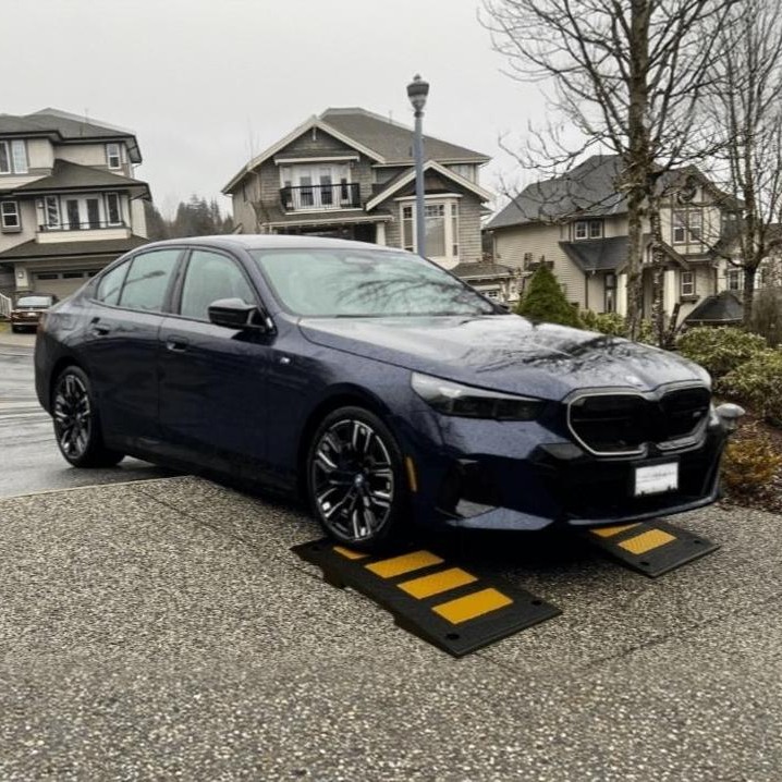 Steep angled driveway entry ramps for low car clearance preventing bottoming out on garage approaches