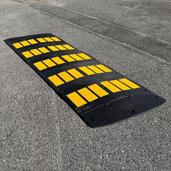 Wide modular rubber driveway ramp for rounded curb entry preventing scraping for low clearance vehicles