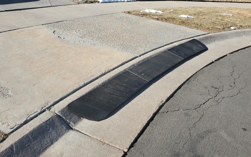 Curb ramp to prevent car scraping