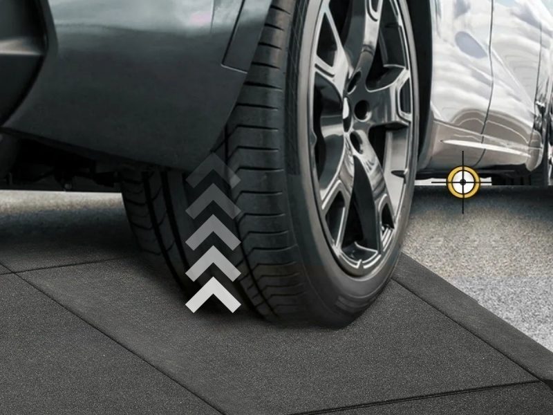 Close-up of a vehicle wheel using a QuickLift Ramp Kit for safe curb and driveway clearance.