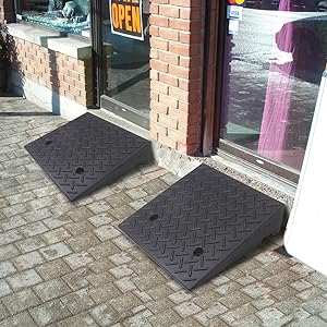 Heavy duty rubber curb ramps installed for easy storefront access over curbs