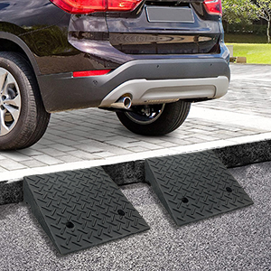 Heavy duty rubber garage and sidewalk ramp installed to assist cars and SUVs in navigating curbs