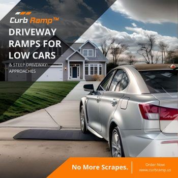 Sedan with low clearance using a curb ramp to safely navigate a steep driveway.