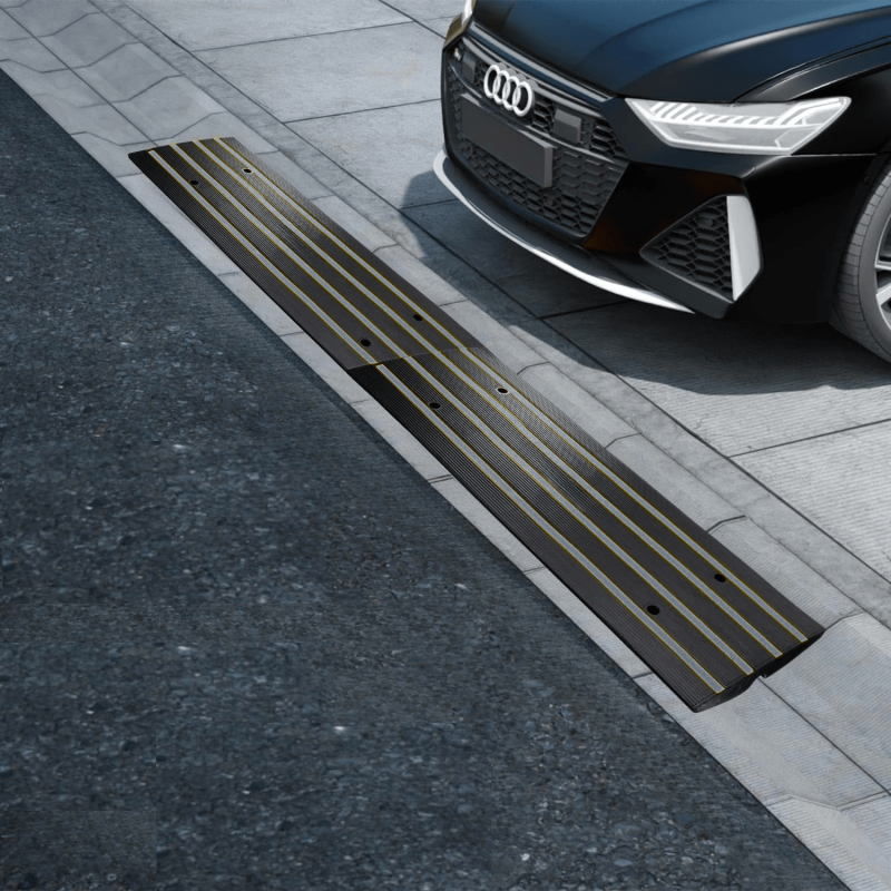 Driveway curb ramp with yellow stripes preventing scraping for low-clearance vehicles