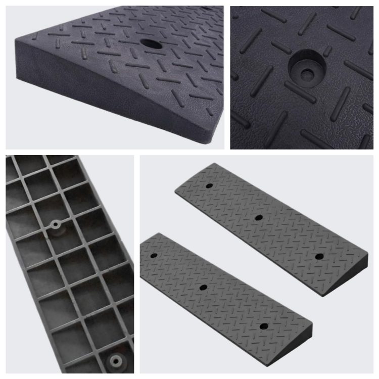 Black driveway ramp designed for low-clearance vehicles to overcome steep driveway approaches and small thresholds without damaging the car's underside.