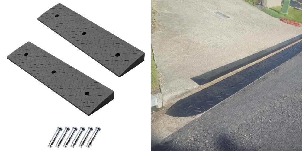 Heavy-duty modular ramps installed for vehicle clearance on steep driveway lips.