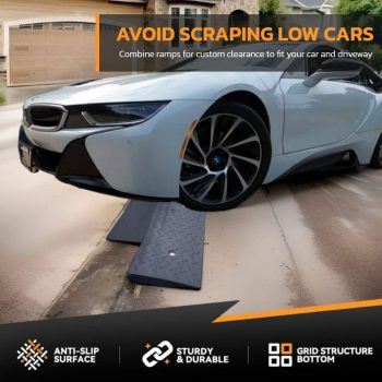 White sports car using anti-slip driveway ramps for low car clearance over a steep curb, featuring a durable and sturdy design.