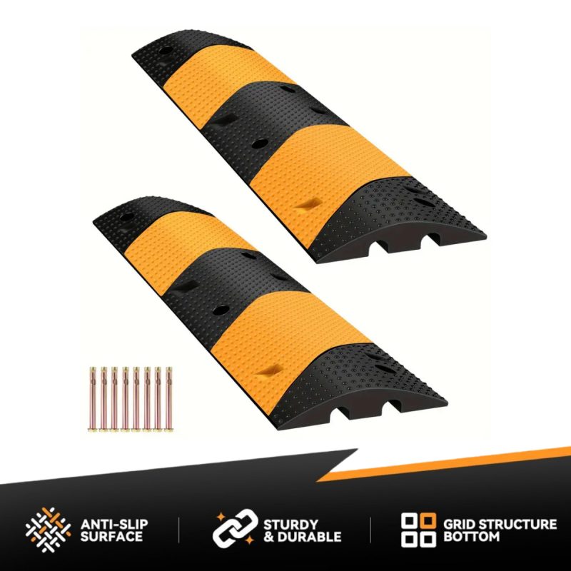 Heavy-duty modular speed bumps with black and yellow design for vehicle clearance and traffic calming.