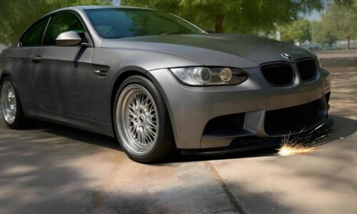 Low car front splitter scraping on a rolled curb driveway dip