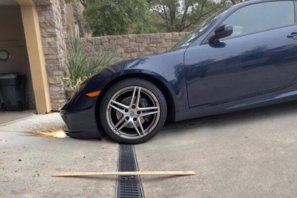 low-car-hitting-garage-entry-over-french-drain-steep-driveway-transition-bumper-scrape low-car-hitting-garage-entry-over-french-drain-steep-driveway-transition-bumper-scrape