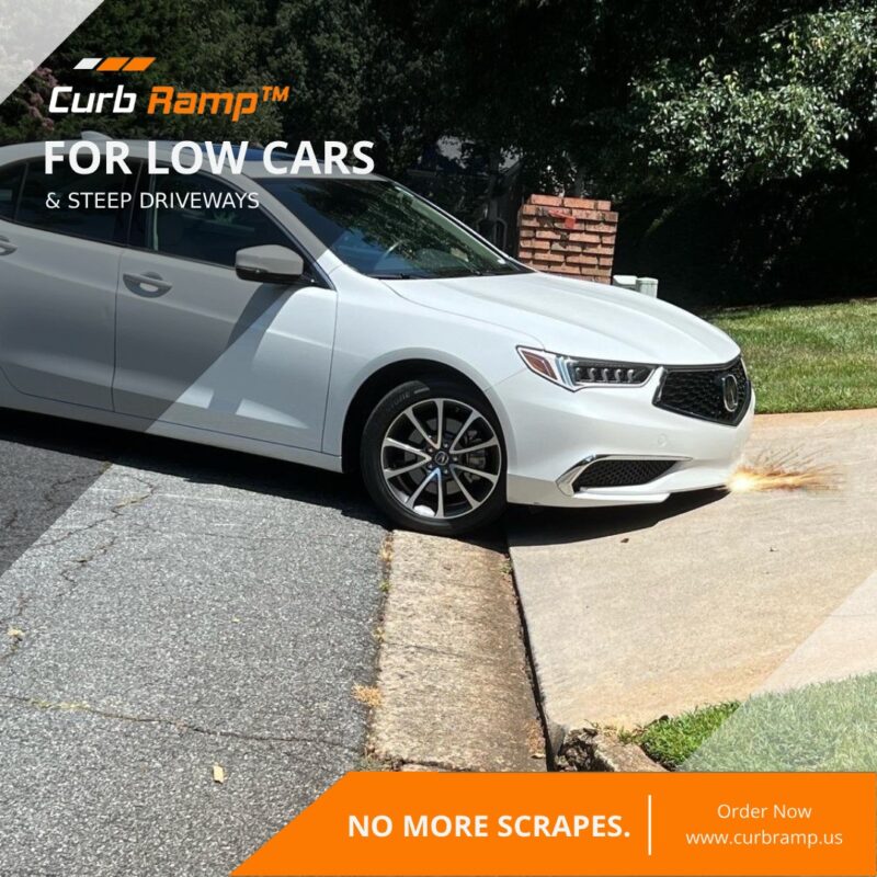Low Car Scraping on Steep Driveway Entry Before Ramp Solution Low-clearance car scraping at a steep driveway entrance where the curb edge creates a sudden drop with no ramp installed.