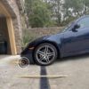 low-sports-car-scraping-garage-entry-steep-driveway-french-drain-clearance-problem