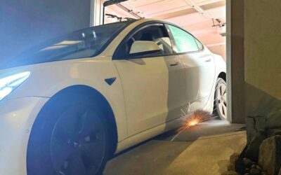 car-scrapes-garage-entry-steep-driveway-dropoff