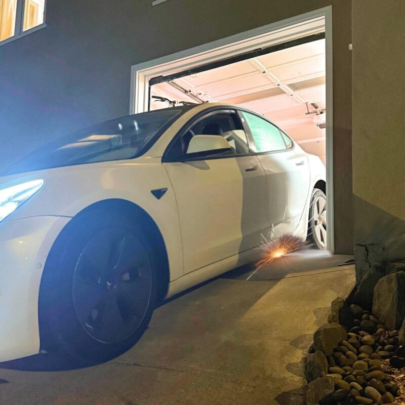 car-scrapes-garage-entry-steep-driveway-dropoff